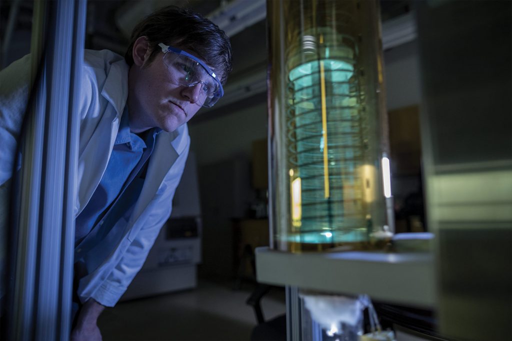 Student checks on equipment in SMRC Lab